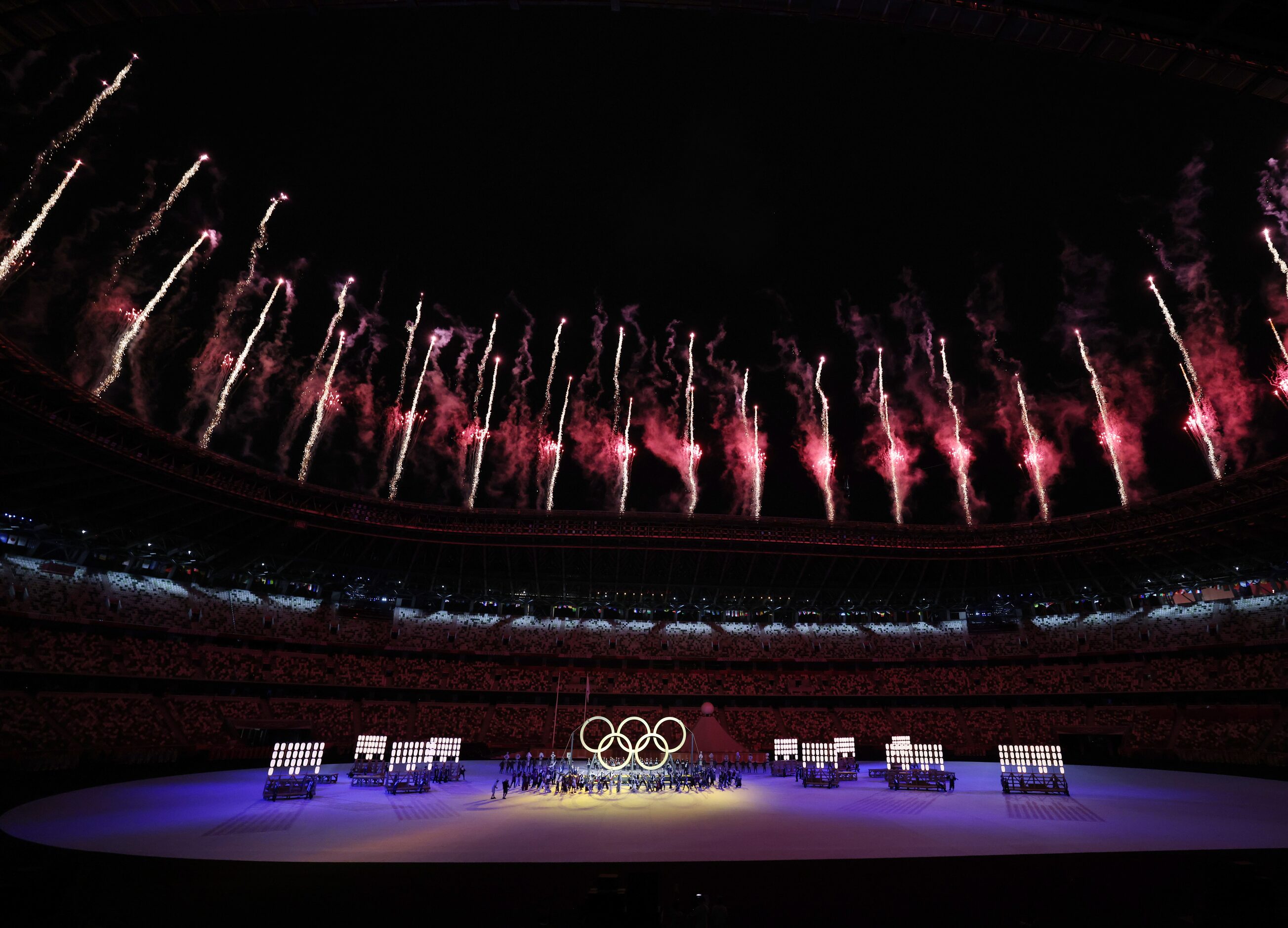 Fireworks go off as the Olympic rings are shown during the opening ceremony for the...