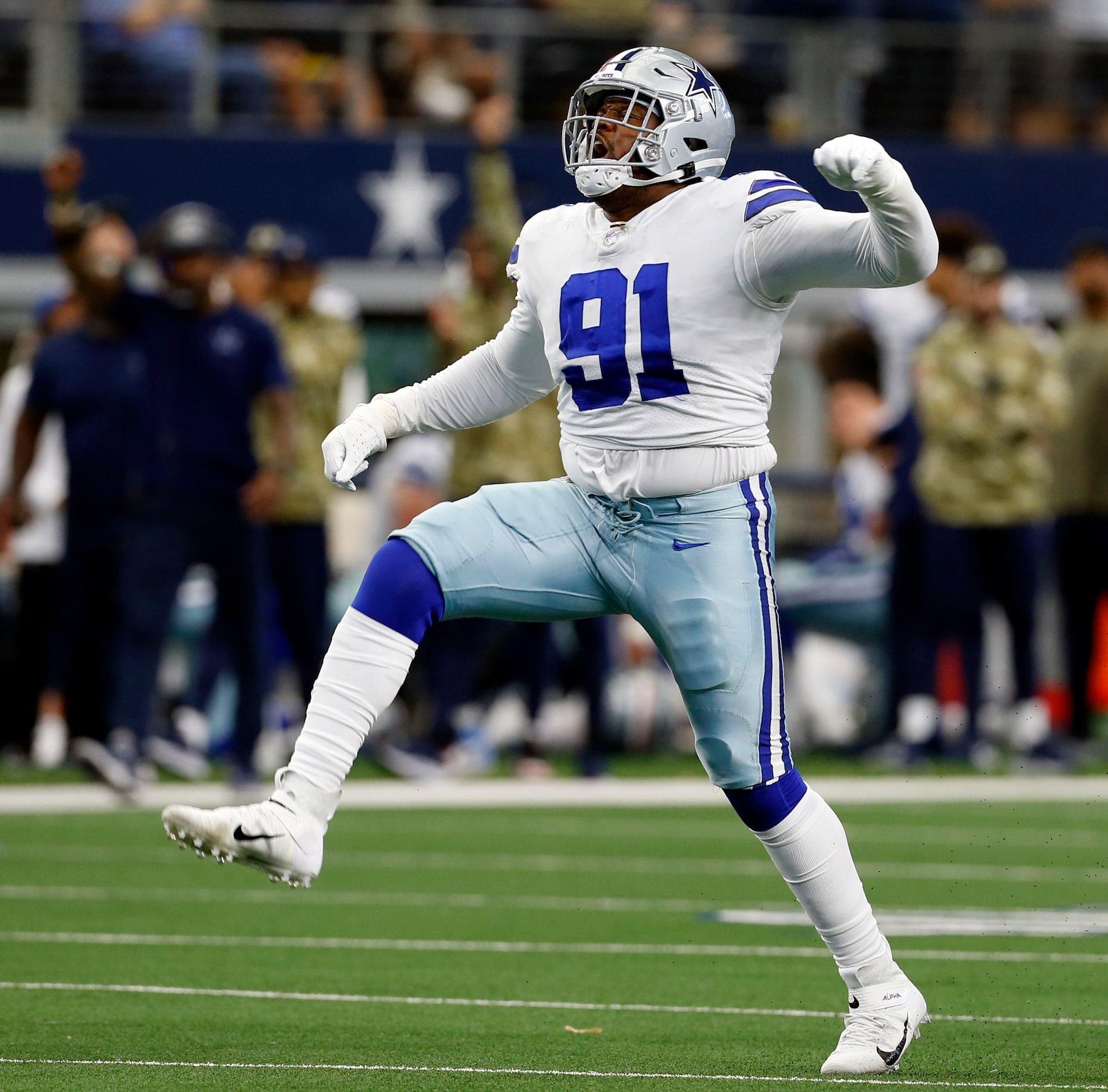 Dallas Cowboys defensive tackle Carlos Watkins (91) celebrates after making a sack during...