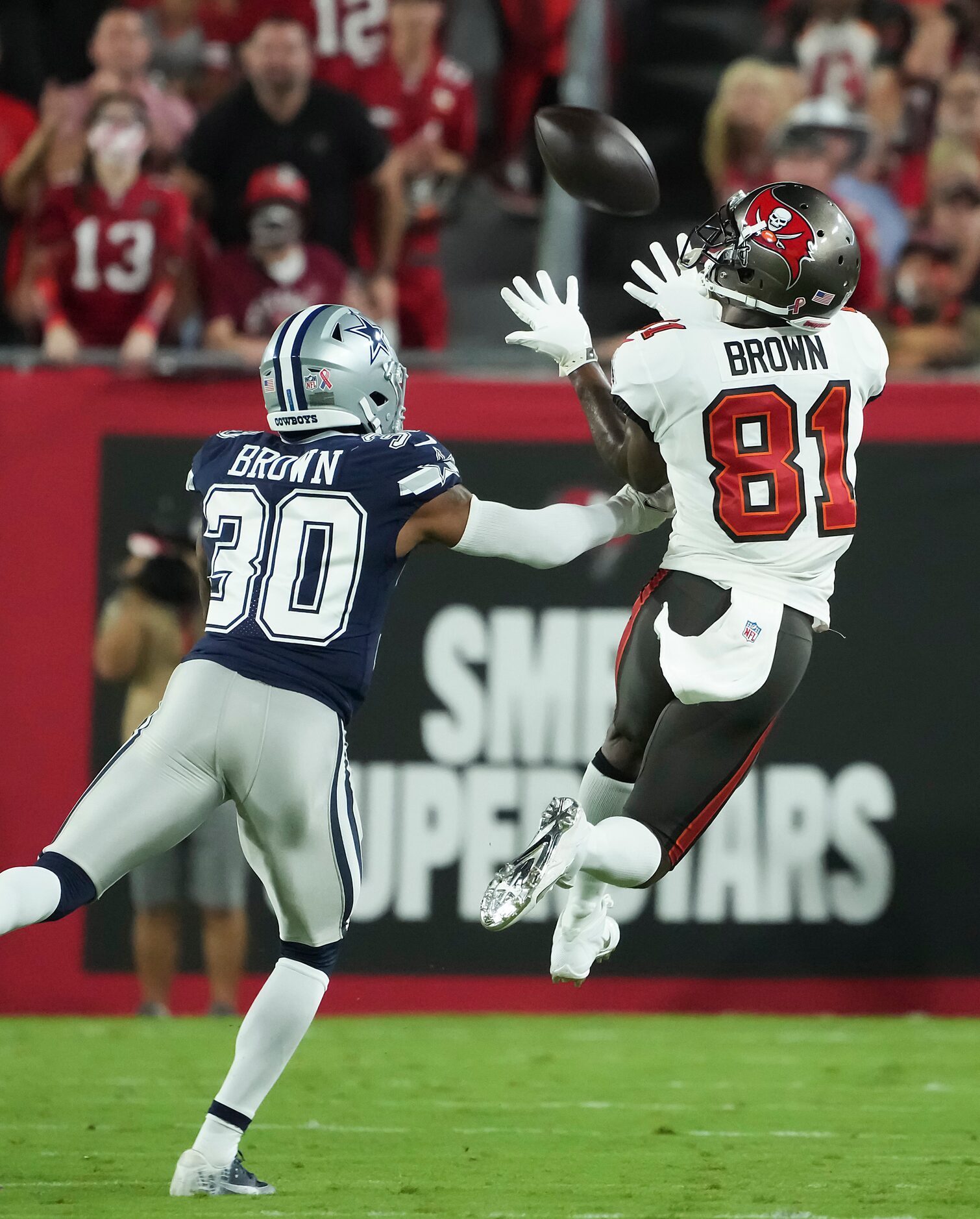 Tampa Bay Buccaneers wide receiver Antonio Brown (81) hauls in a long pass as Dallas Cowboys...