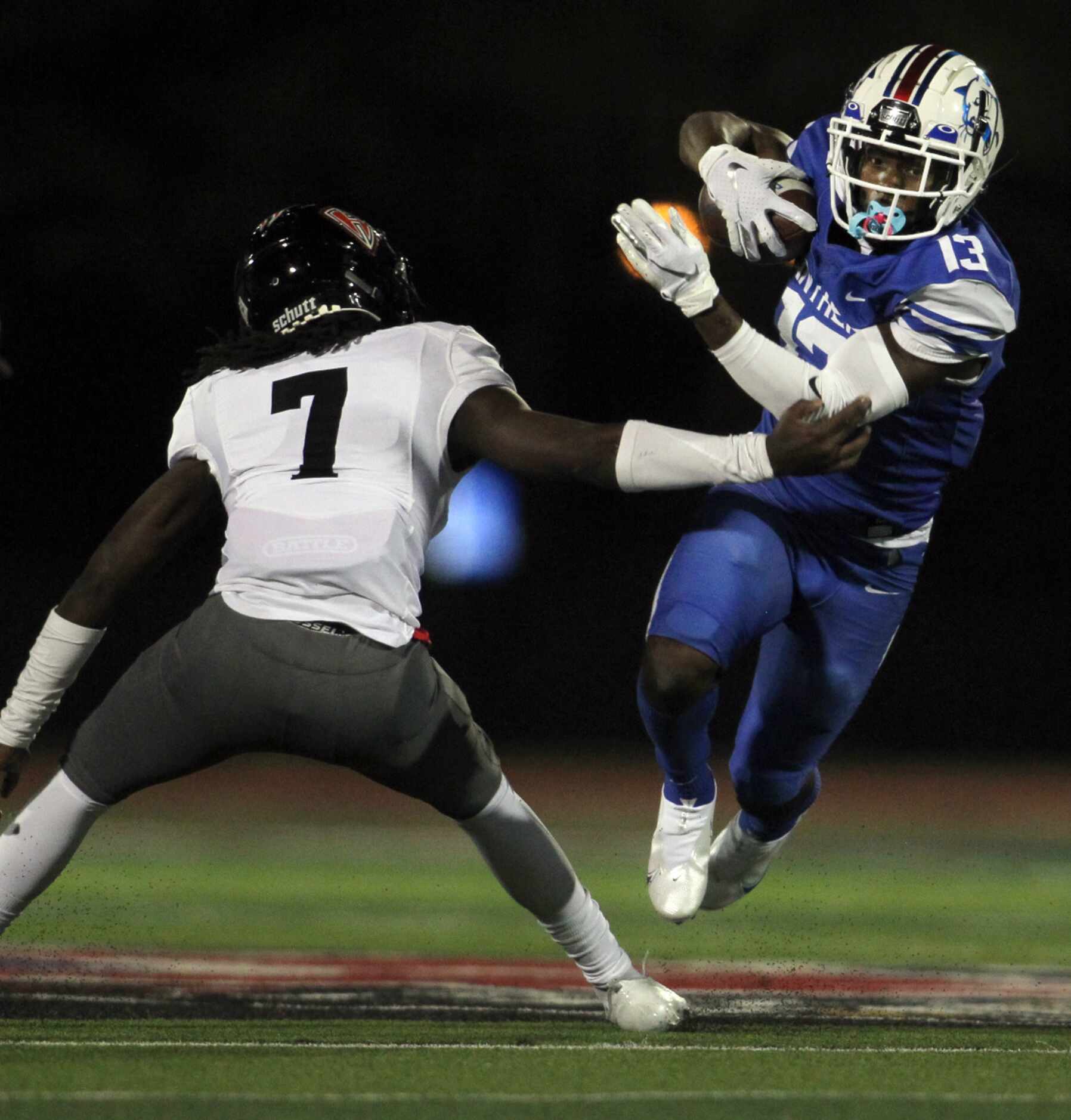 Duncanville receiver Roderick Daniels, Jr, (13) tacks on extra yardage as he maneuvers past...