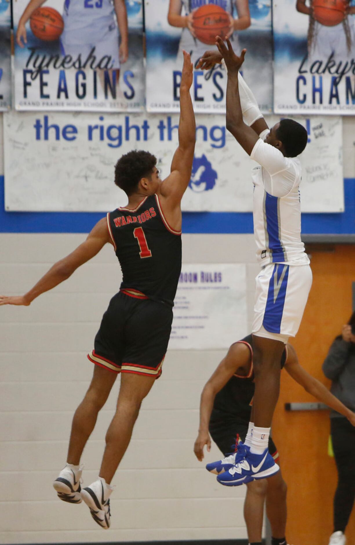 Grand Prairie's Jaylin Posey (1) scores on a jump shot over the defense of South Grand...