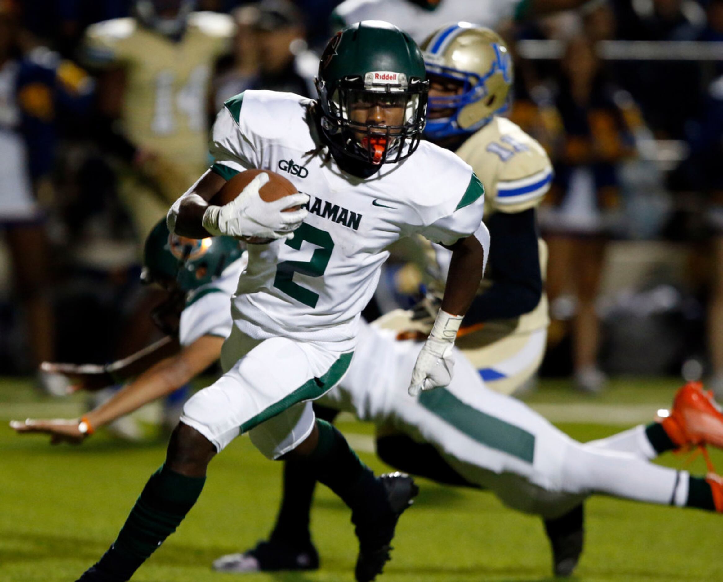 Naaman Forest Kingsley Bennett (2) takes his fumble recovery back for a touchdown during the...