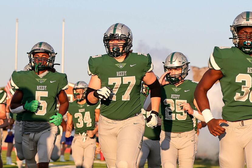 The Frisco Reedy Lions enter the field to face Frisco Lone Star in a high school football...