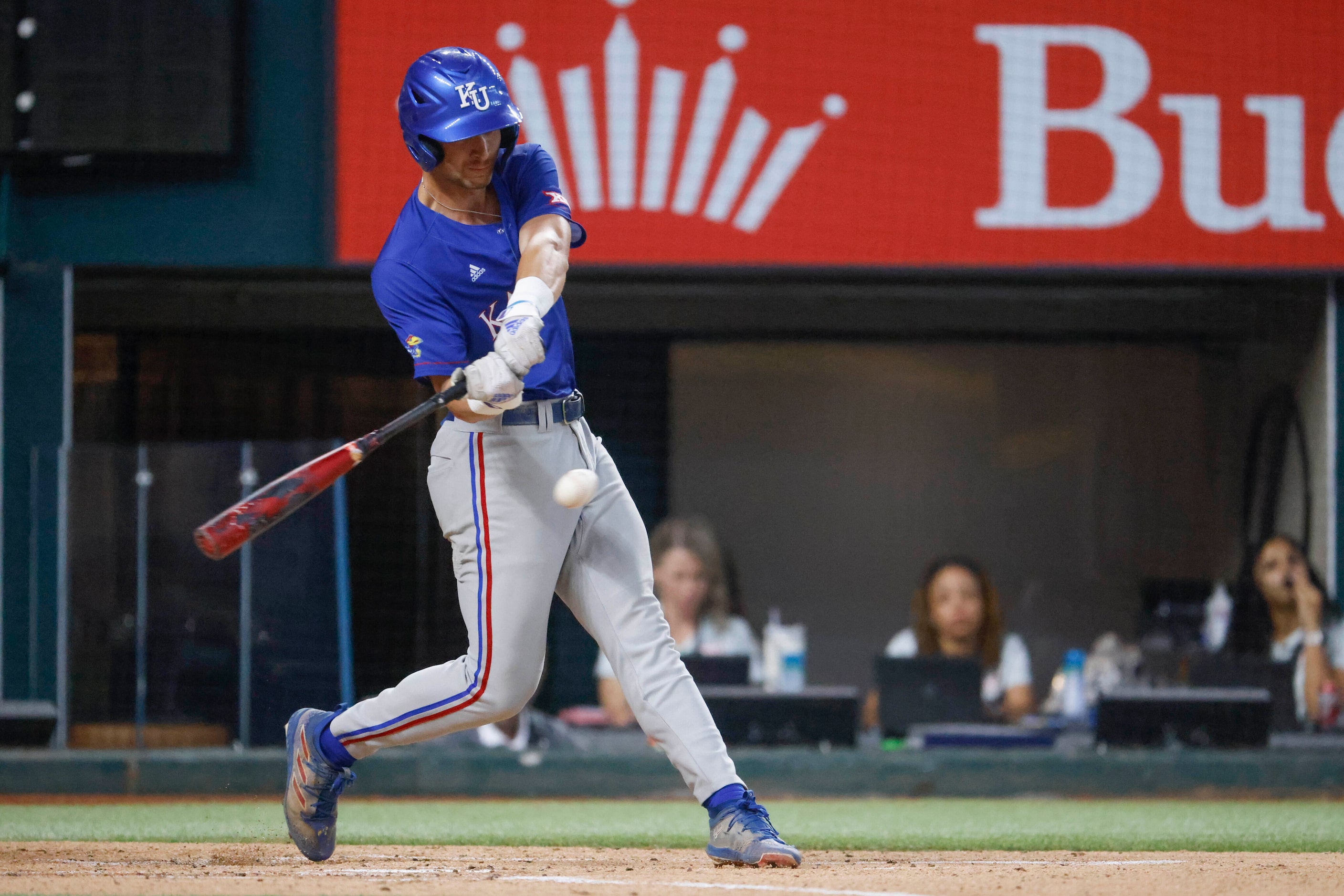 Kansas infielder Collier Cranford hits for a run during the second inning of a baseball game...