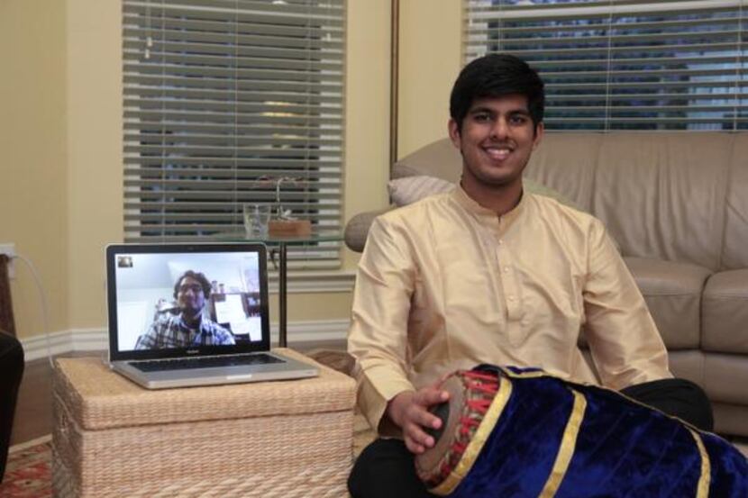 
Plano Senior High School junior Jay Appaji works with his instructor, percussionist Rohan...