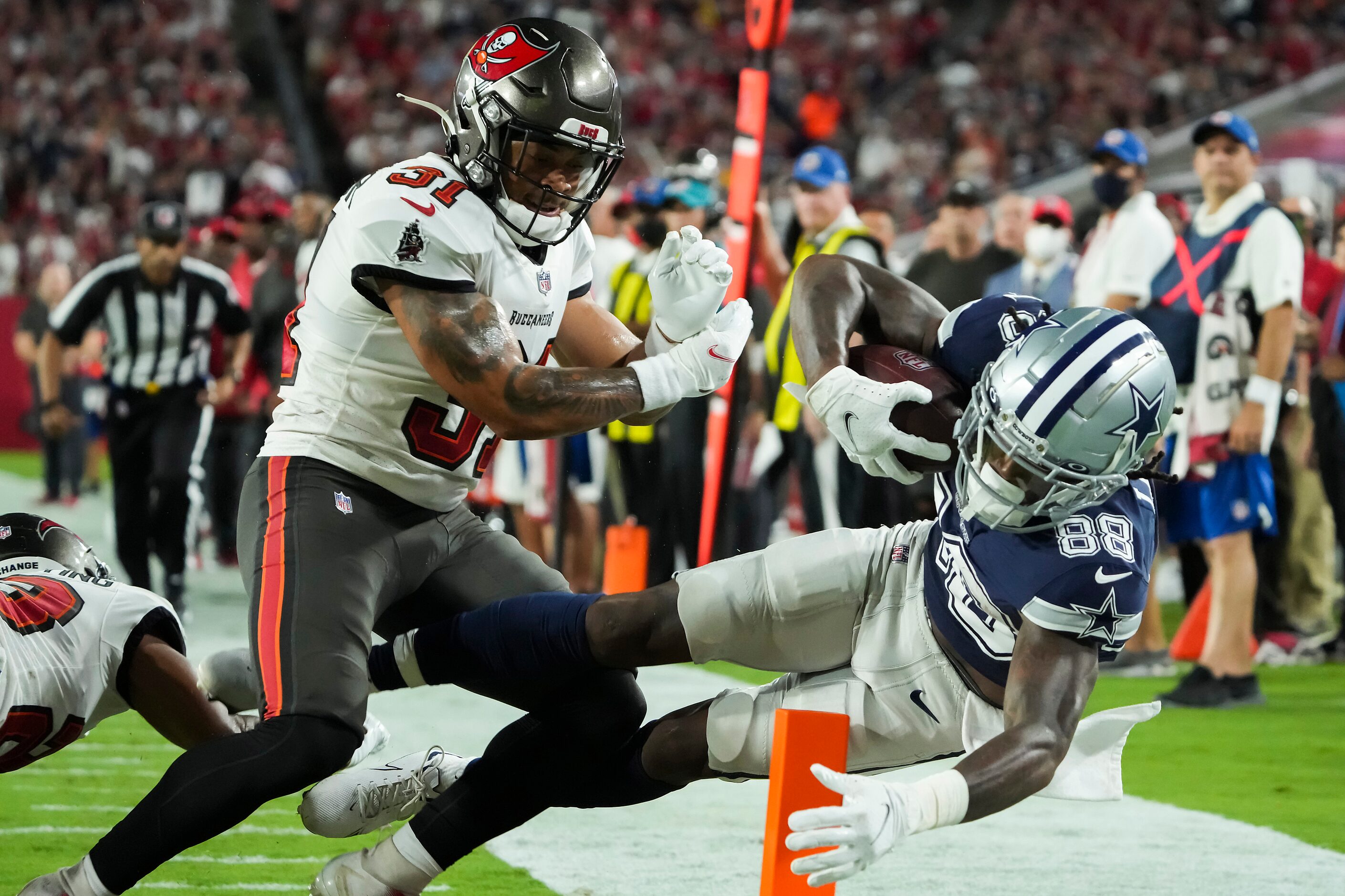 Dallas Cowboys wide receiver CeeDee Lamb (88) scores on a touchdown catch past Tampa Bay...