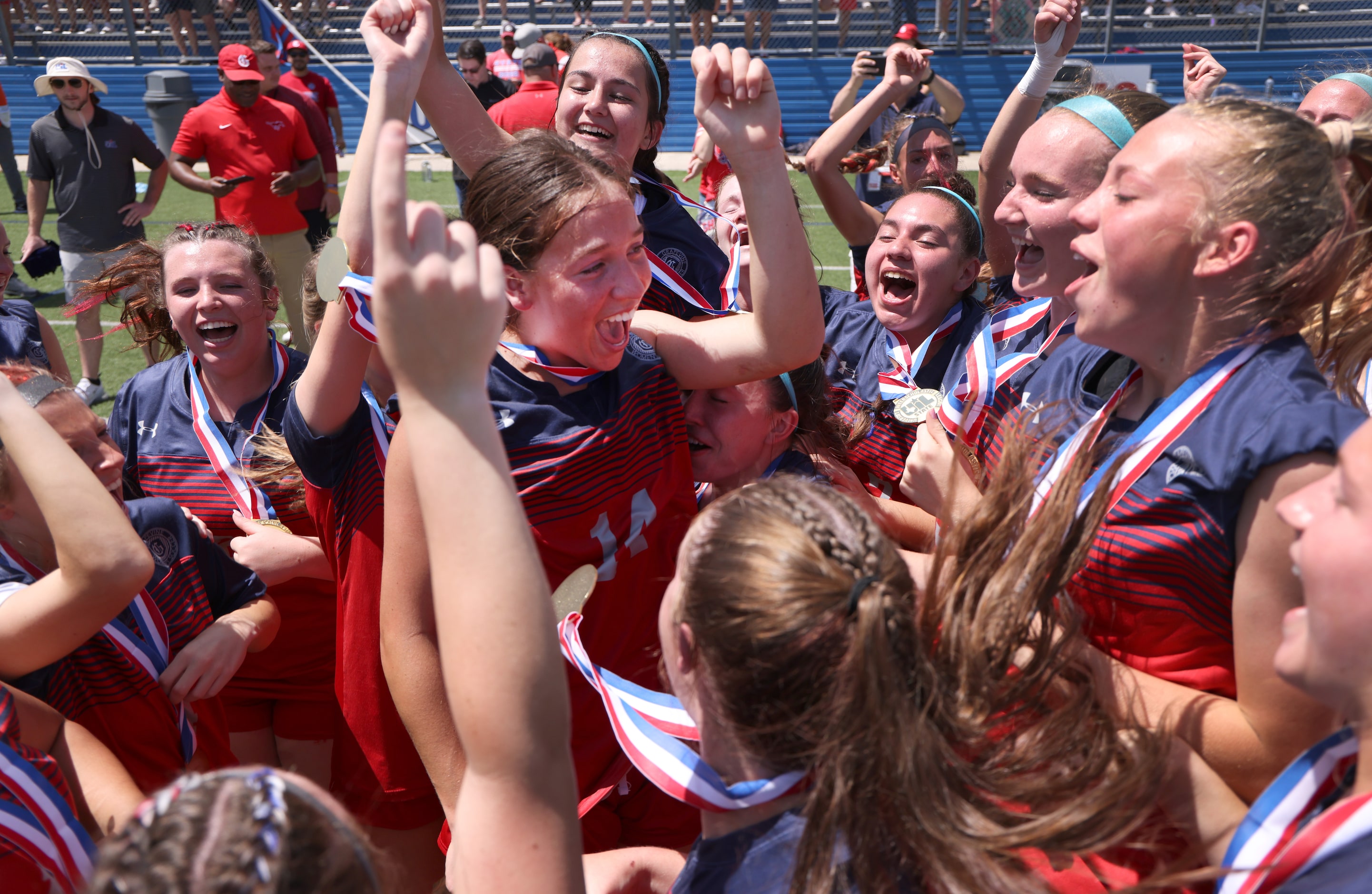 Grapevine forward Theresa McCullough (14), center, is surrounded by teammates after being...