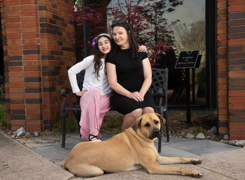 Melissa Watkins and her daughter, Mila, 11, with their dog, Leah, outside of Network of...