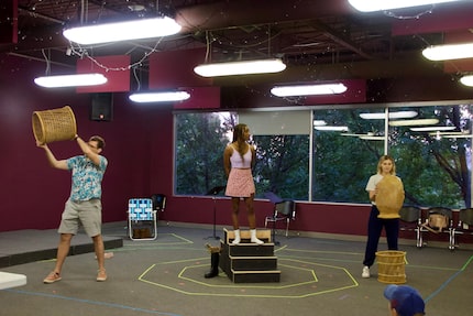 From left, Jon Garrard, Mikaela Baker and Olivia Cinquepalmi rehearse "I Am An Island," a...