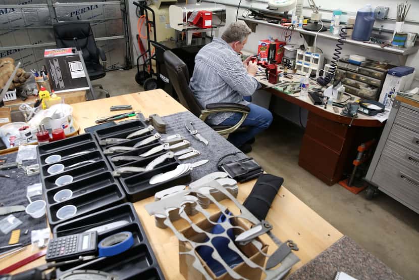 Todd Begg crafts a knife at his shop in Dallas on Jan. 17.