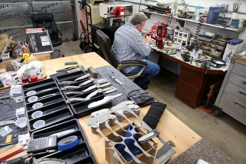 Todd Begg crafts a knife at his shop in Dallas on Jan. 17.