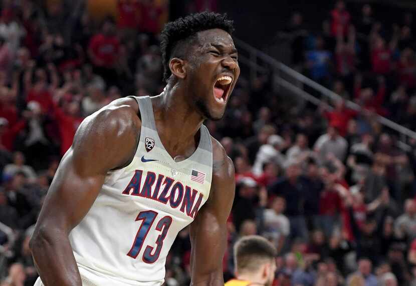 LAS VEGAS, NV - MARCH 10:  Deandre Ayton #13 of the Arizona Wildcats reacts after dunking...