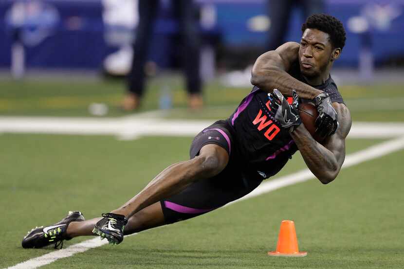Alabama wide receiver Calvin Ridley runs a drill during the NFL football scouting combine,...