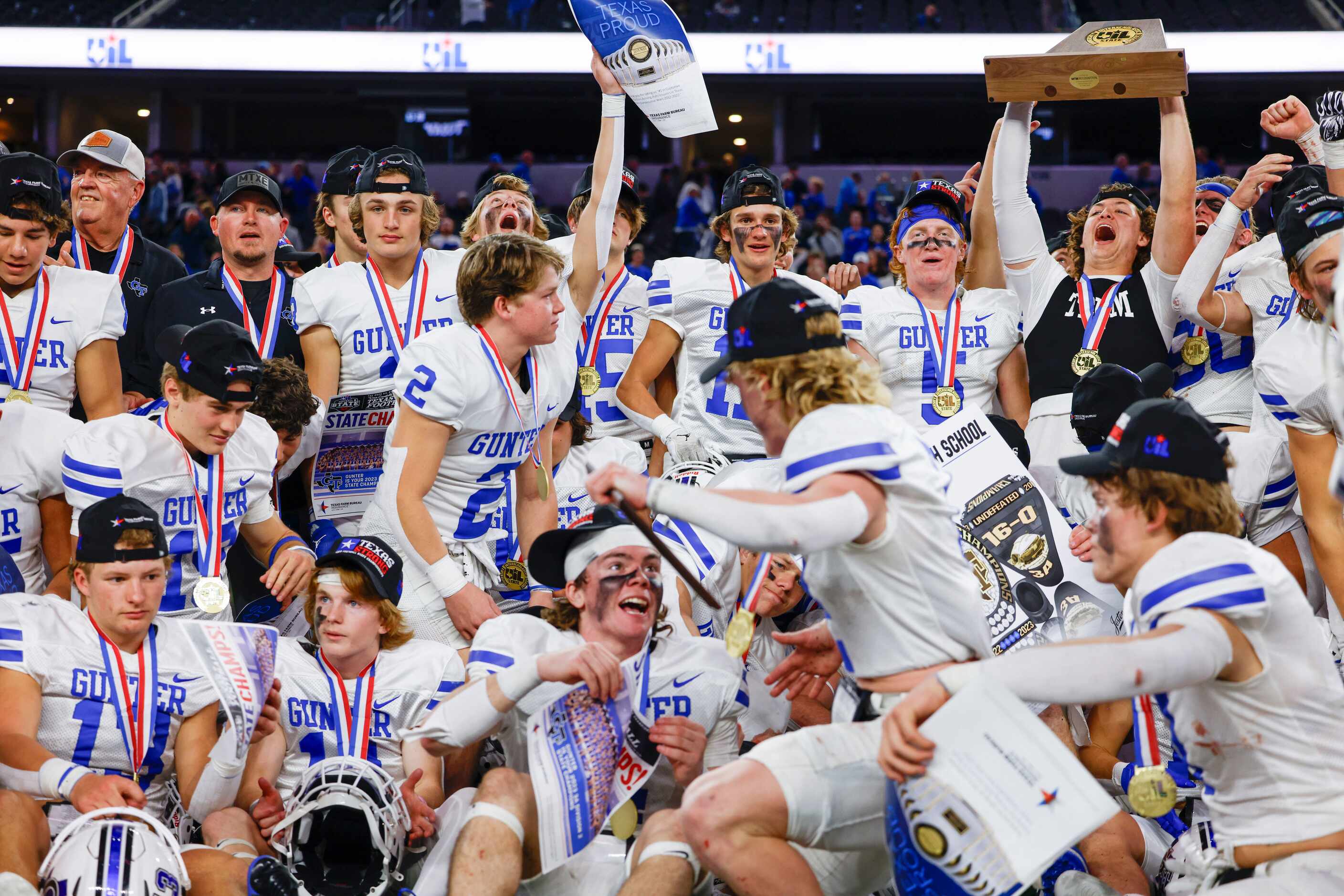 Gunter High players celebrate after winning the Class 3A Division II state championship game...