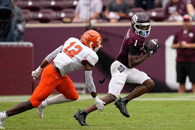 Texas A&M wide receiver Evan Stewart (1) catches a pass as Sam Houston State defensive back...