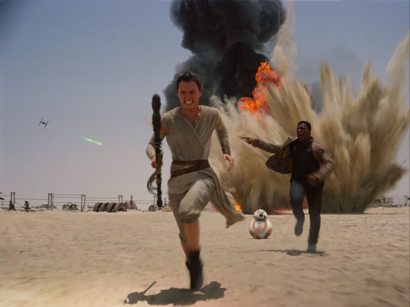 This photo provided by Disney shows Daisy Ridley as Rey, left, and John Boyega as Finn, in a...