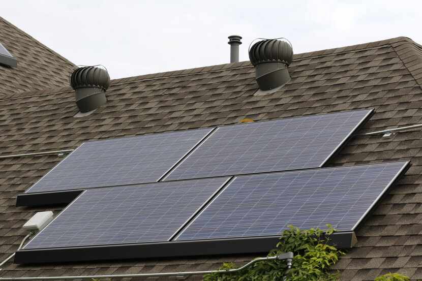 This 2019 file photo shows solar panels on a roof in Allen.