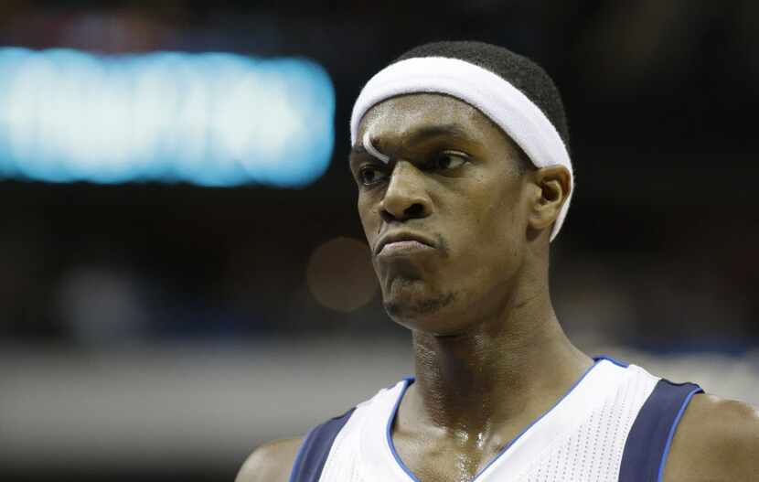 A butterfly closure keeps a cut above Dallas Mavericks guard Rajon Rondo's eye closed during...