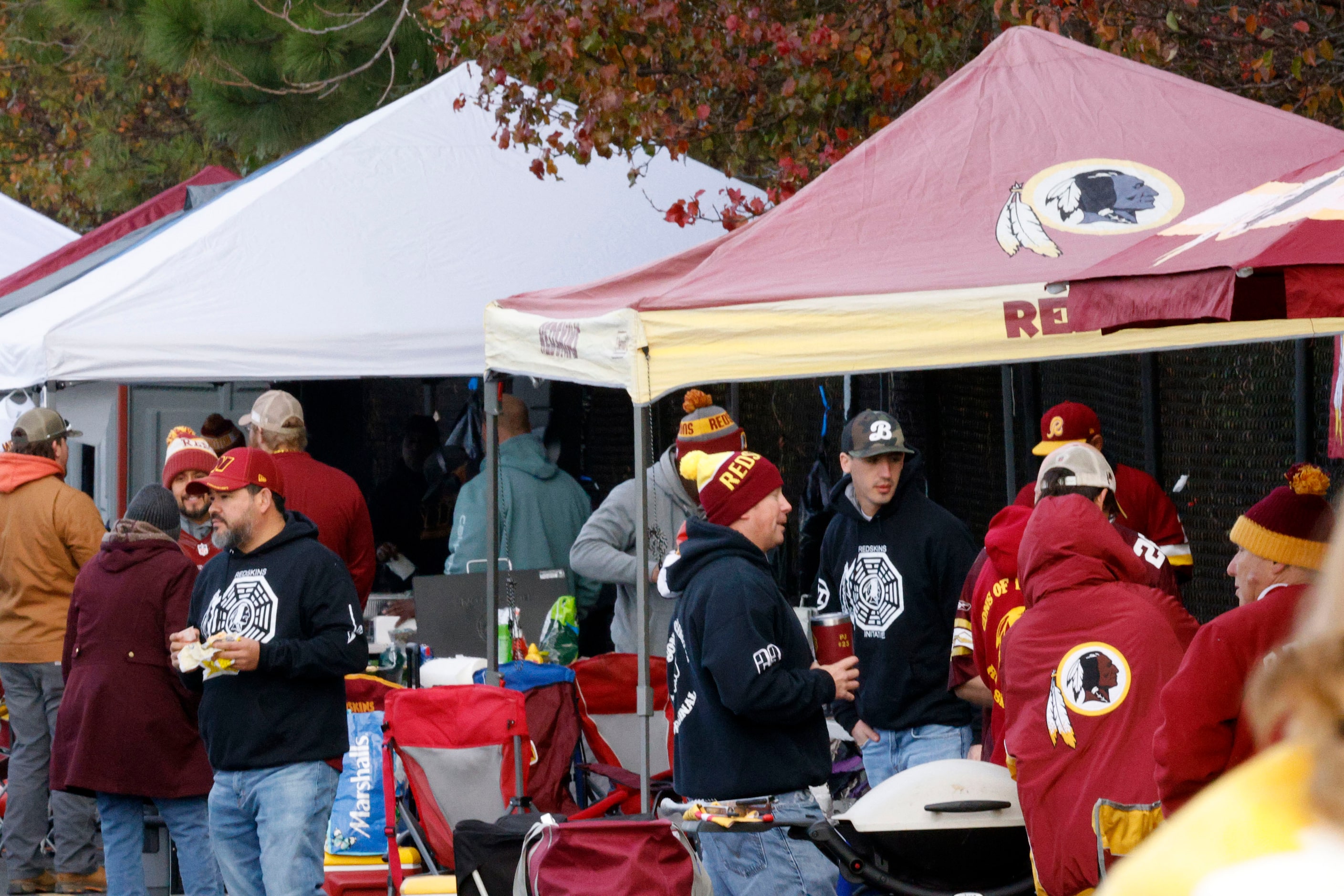 Fans spend time tailgating before an NFL football game between the Dallas Cowboys and the...