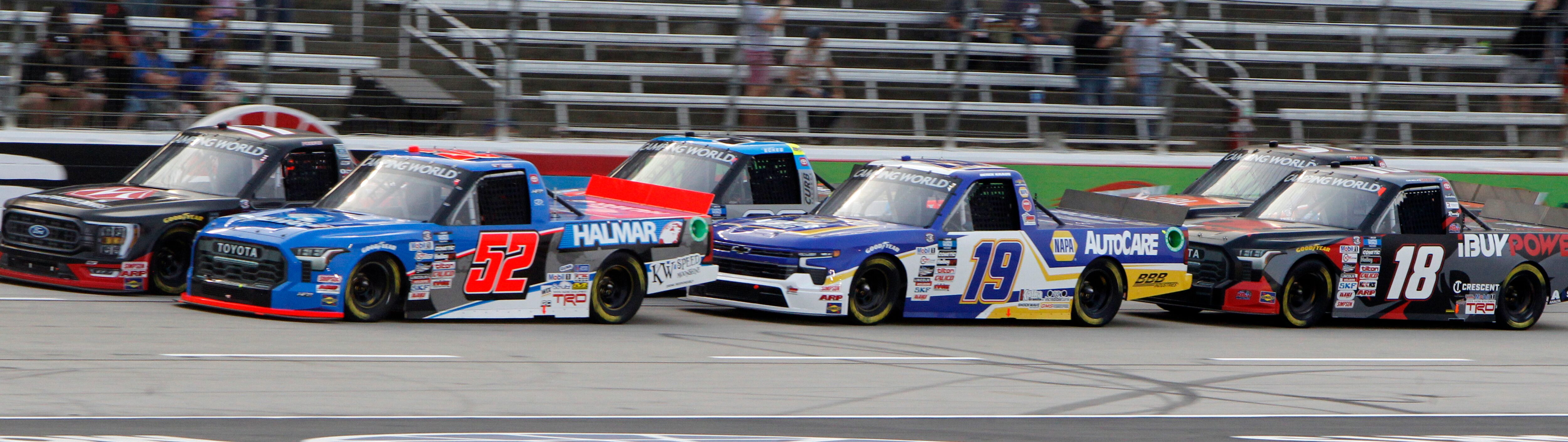 Drivers prepare to come out of a caution. Stewart Friesen, driver of the #52 Halmar...