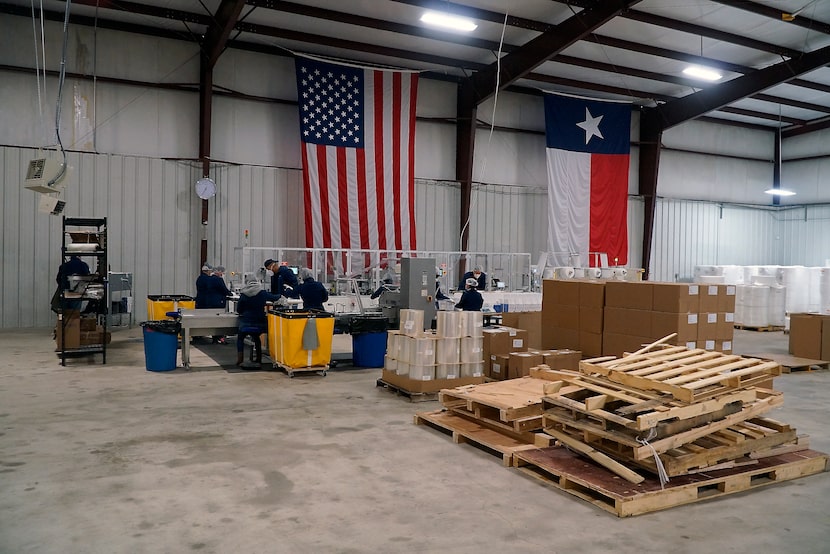 The assembly line can produce up to 20,000 masks a day at United States Mask Co. in Fort Worth.