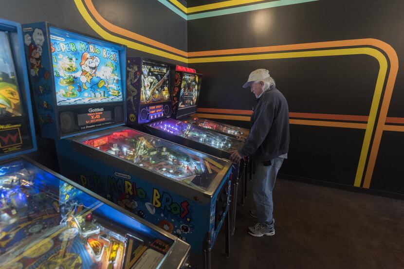 Will Hyden plays pin ball at  Free Play, a retro arcade in Richardson on Friday, Dec. 4,...
