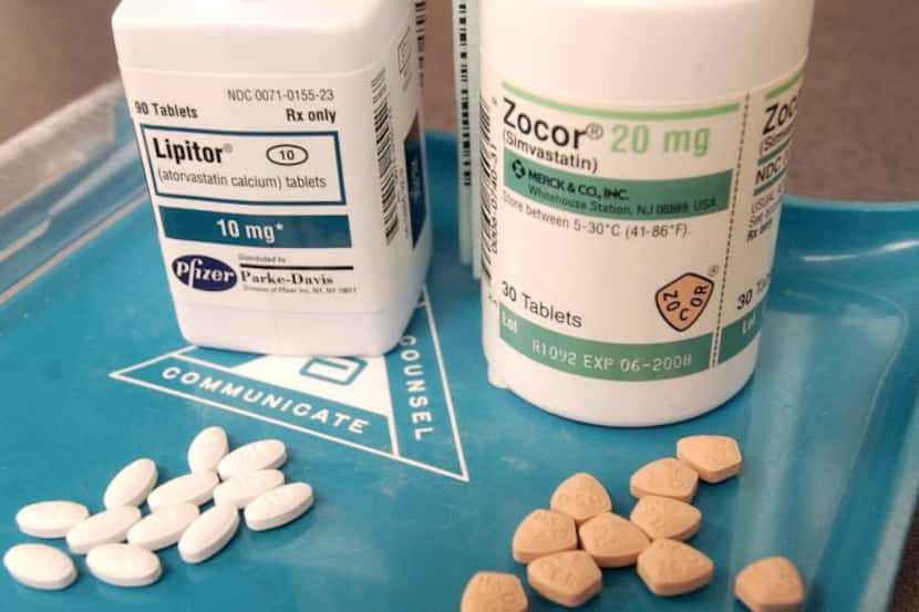 Bottles of Lipitor, left, and Zocor, two popular cholesterol-lowering drugs. (Mike...