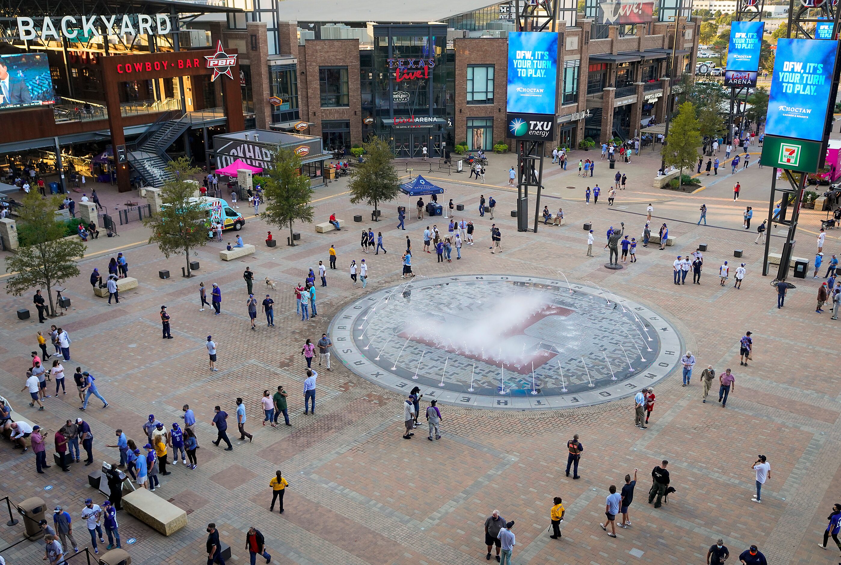 Fans enter the stadium from TexasLive! before Game 1 of the World Series between the Los...