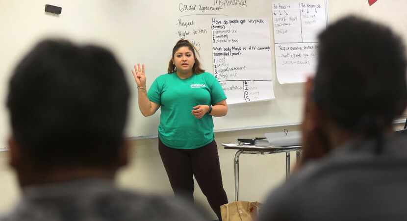 Amanda Mendoza talks with students during a sex education class for kids in Vickery Meadow,...