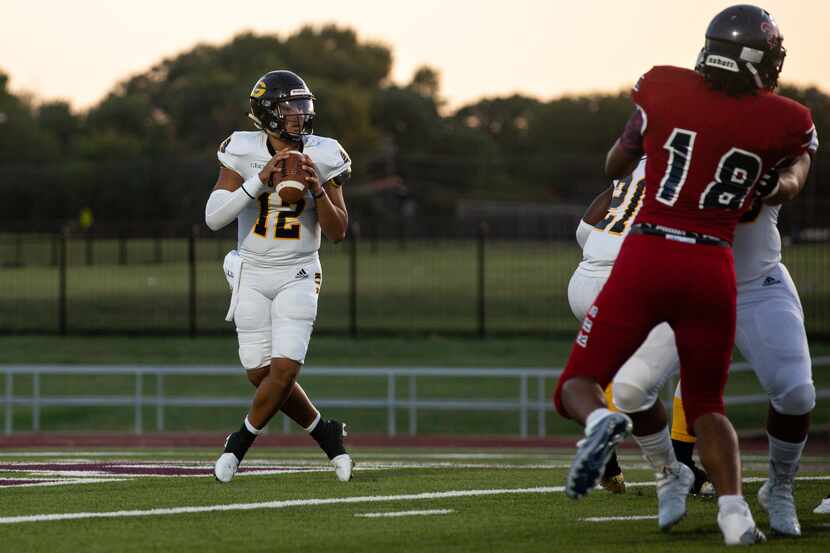 Garland High School quarterback Cergio Perez (12) runs the ball during their season-opening...