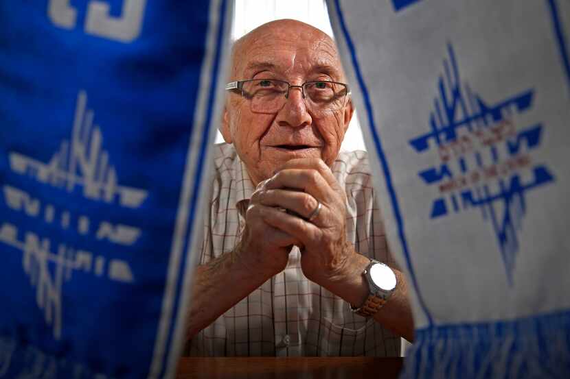 Max Glauben, a Holocaust survivor, poses for photograph with a "March of the Living" scarf...