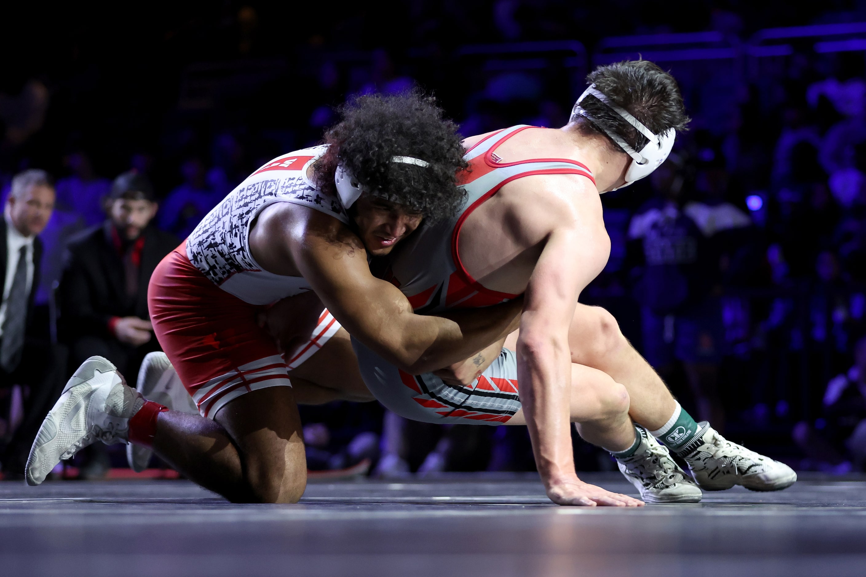 Ibraheem Ahmed of Arlington Martin (red) competes against Rocco Grazier of Houston Bellaire...