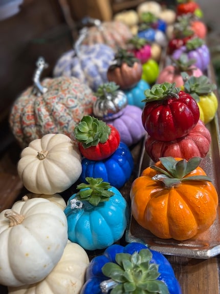 Spray paint your pumpkins in vibrant tones to add a hint of unexpected color to your fall...