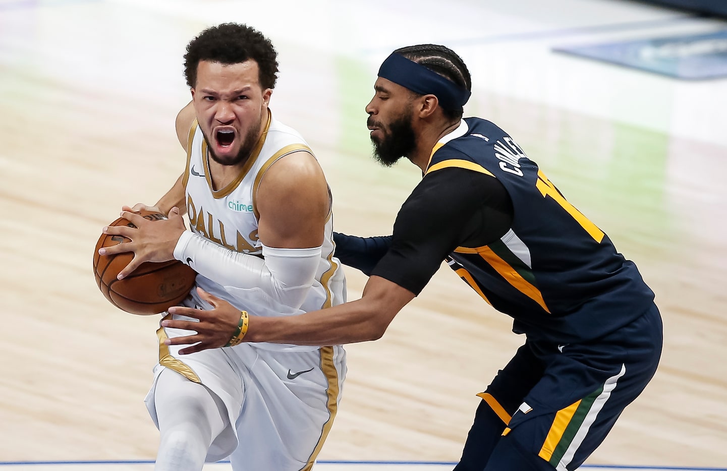 Dallas Mavericks guard Jalen Brunson (13) battles Utah Jazz guard Mike Conley (10) for space...