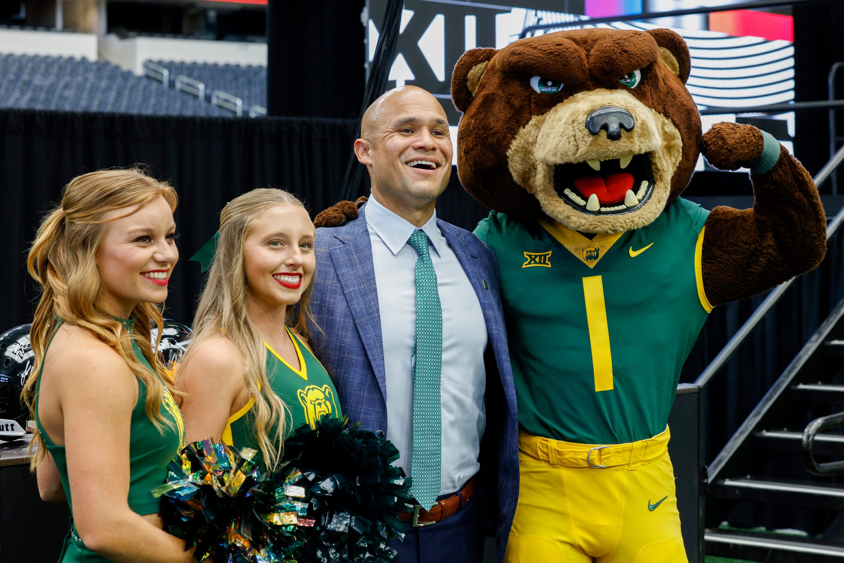 Baylor head coach Dave Aranda poses for a photo with cheerleaders and mascot Bruiser during...