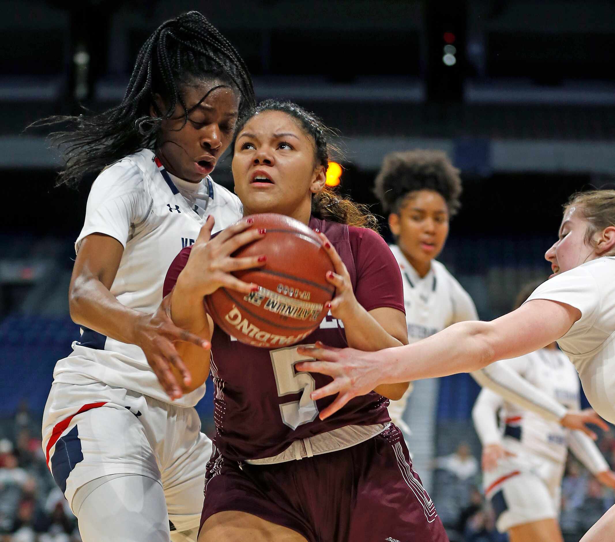 Mansfield Timberview guard Nina Milliner #5 drives to the basket against SA Veteran in a 5A...