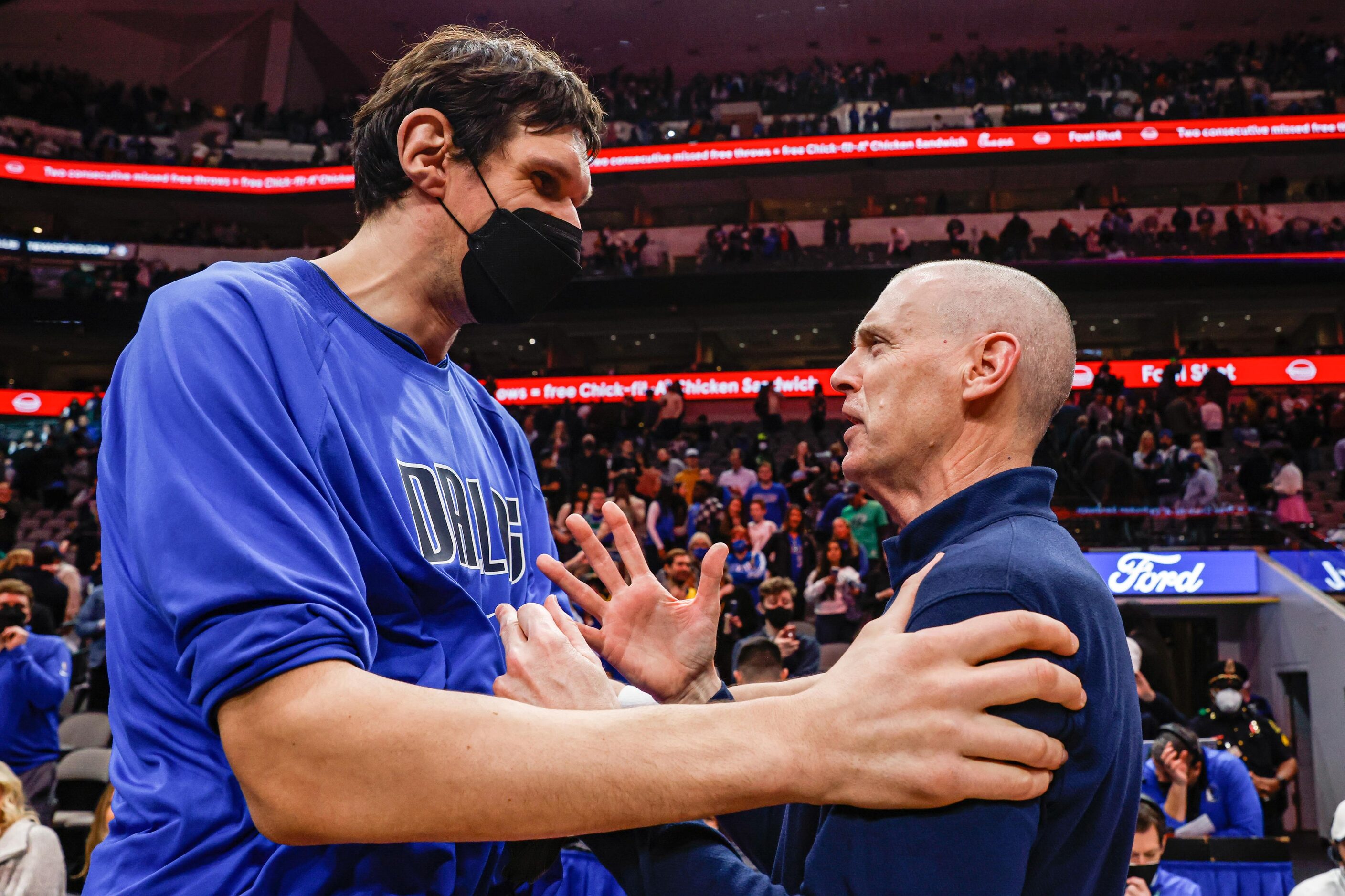 Dallas Mavericks center Boban Marjanovic (51) greets Indiana Pacers coach Rick Carlisle...