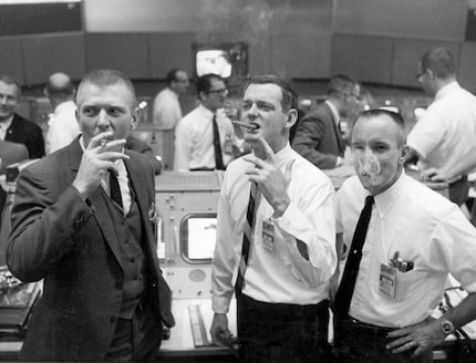  At the end of the Apollo 7 mission, flight controllers Gene Kranz (left), Glynn Lunney and...