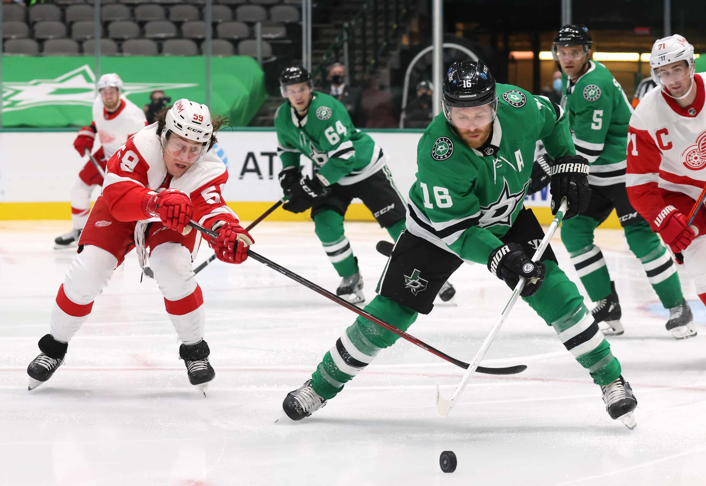 Dallas Stars center Joe Pavelski (16) secures the puck as Detroit Red Wings left wing Tyler...