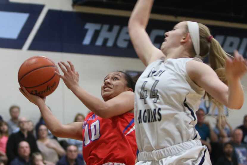 Duncanville guard Nina Alvarez (10) goes up for a layup on a fast break as Flower Mound post...