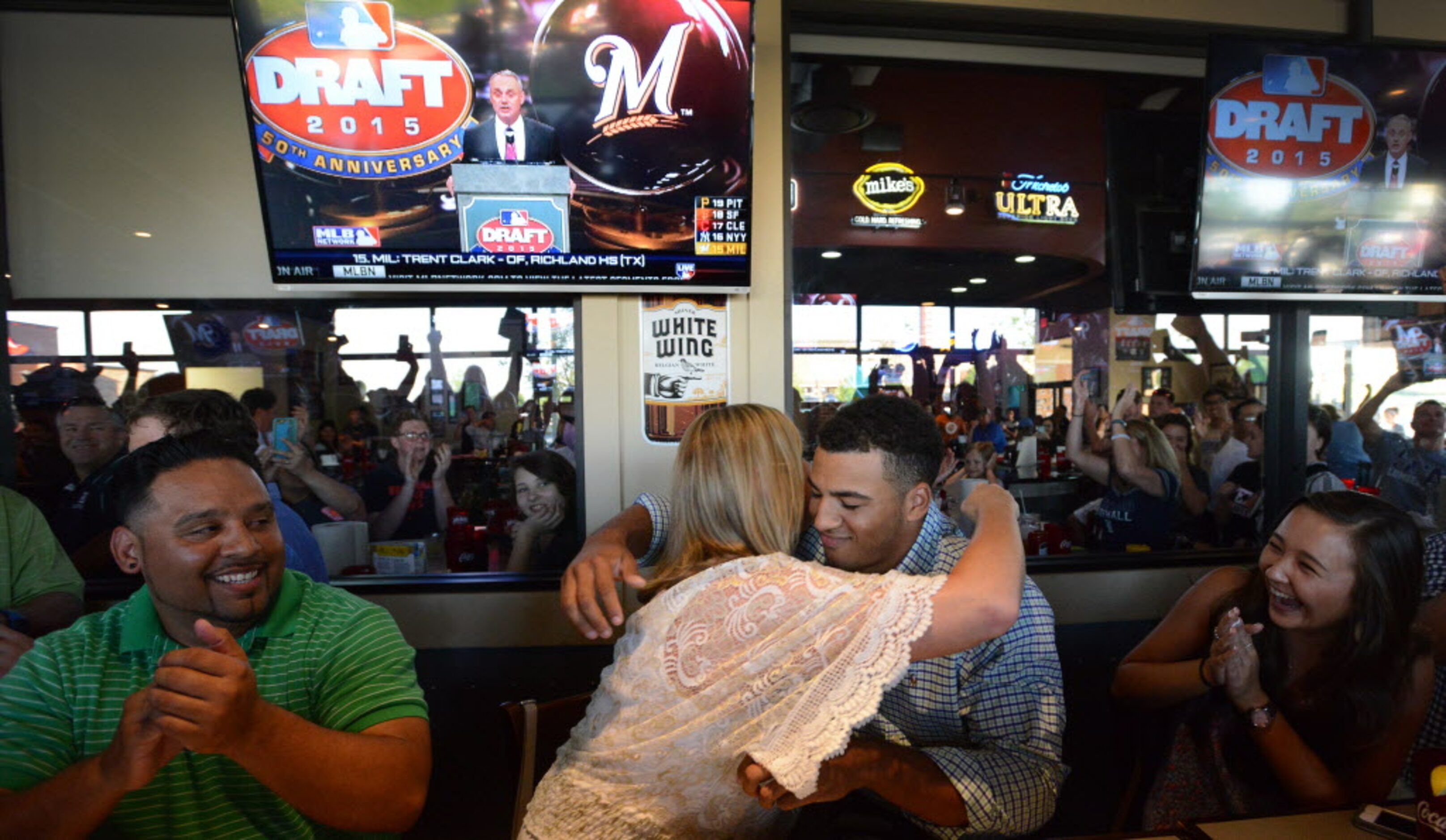 Michelle Grisham, Trent Clarks mother, hugs her son as John Guajardo, left, and Megan...