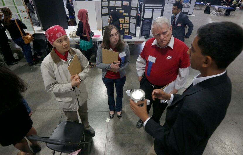 (from left) Judges Chieu Mai, Jennifer Mabry and Tim Abrams listen as Anup Arvind of Plano's...