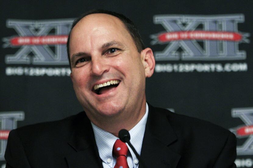 Oklahoma athletic director Joe Castiglione talks with reporters during the Big 12 meetings...