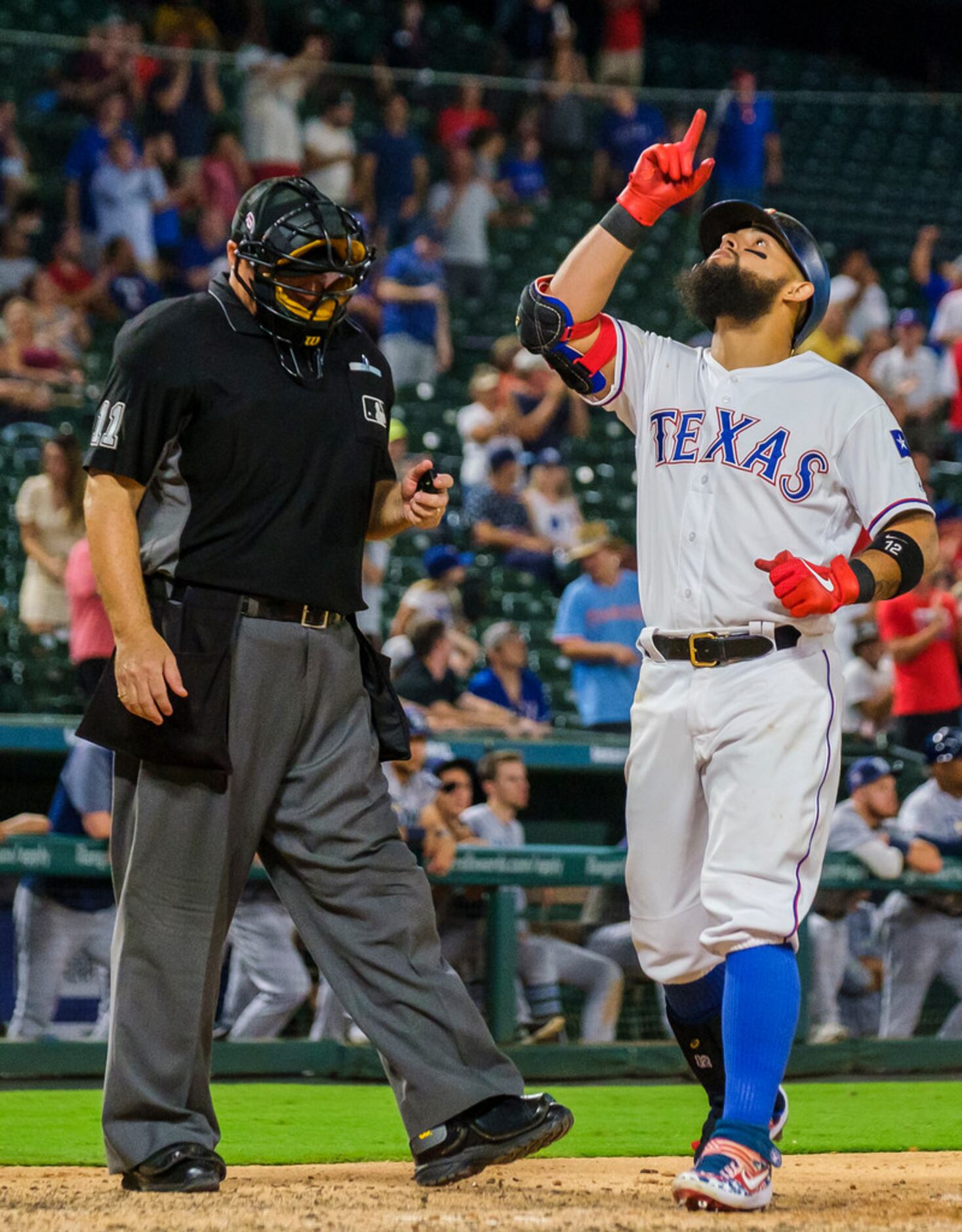 Texas Rangers second baseman Rougned Odor celebrates after hitting a 3-run home run during...