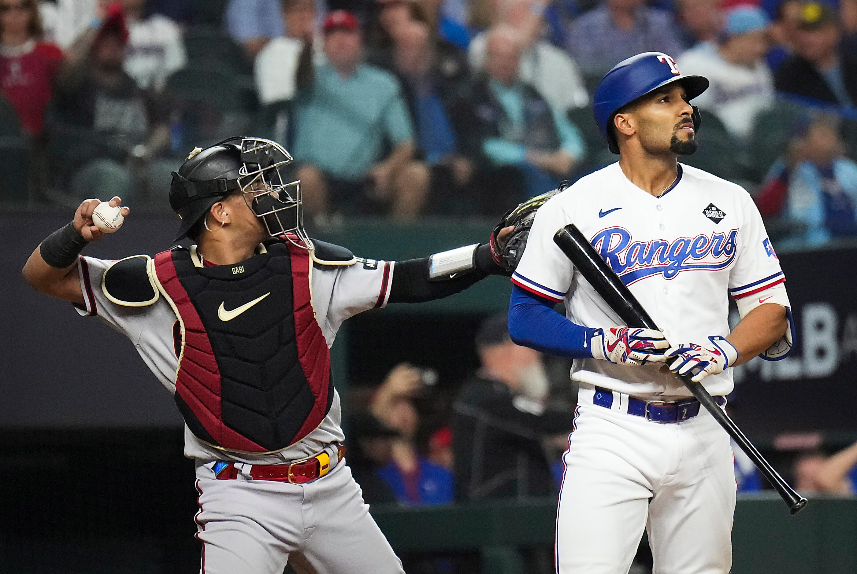 Texas Rangers' Marcus Semien reacts after being called out on strikes during the sixth...