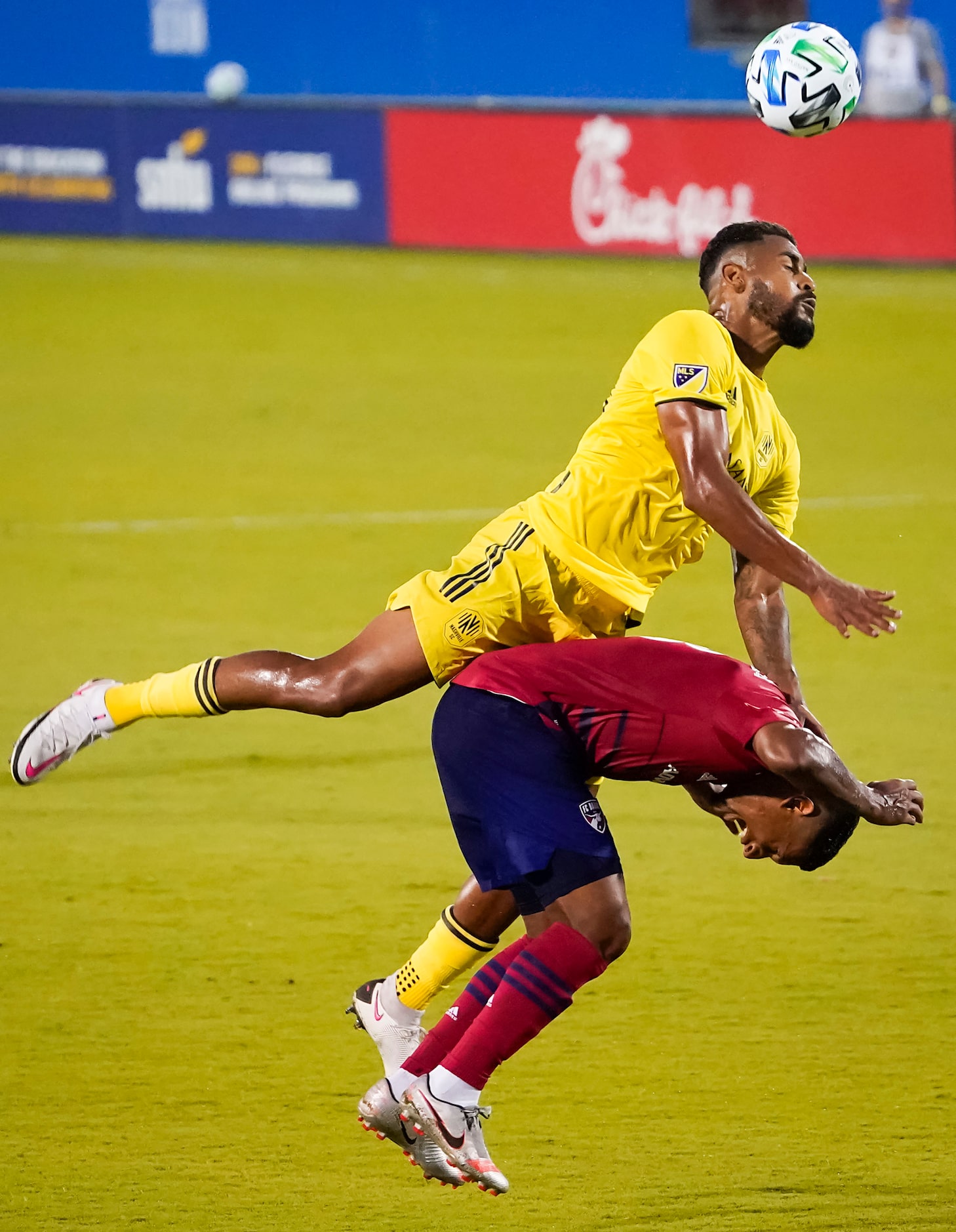 Nashville SC midfielder Anibal Godoy (20) comes down on FC Dallas midfielder Bryan Acosta...