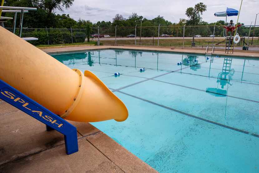 Lifeguard Joshua Acosta, 17, looks over the empty Glendale swimming pool in the east Oak...