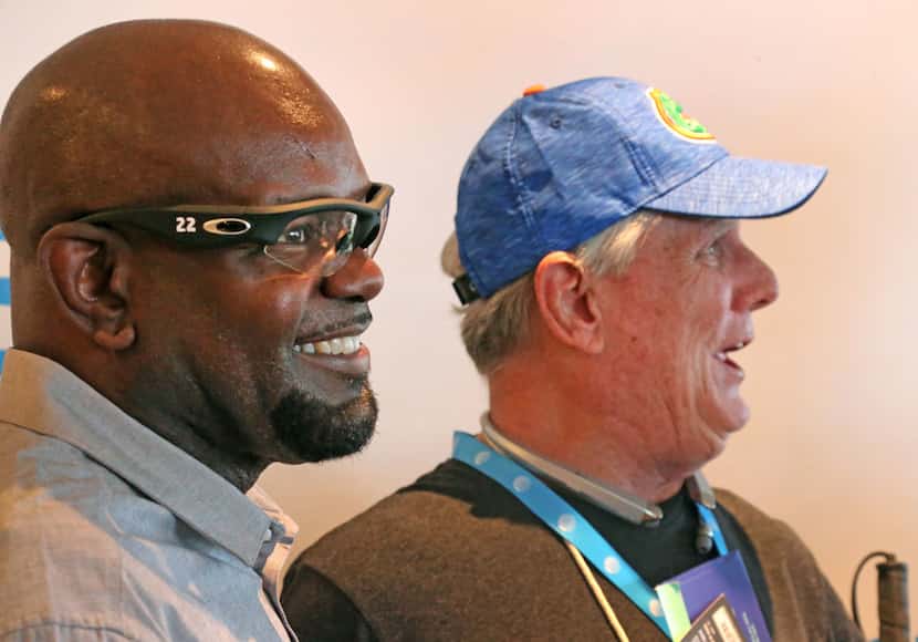 Cowboys Hall of Famer Emmitt Smith visits with Pete Lane, whom he helped "see" the game with...