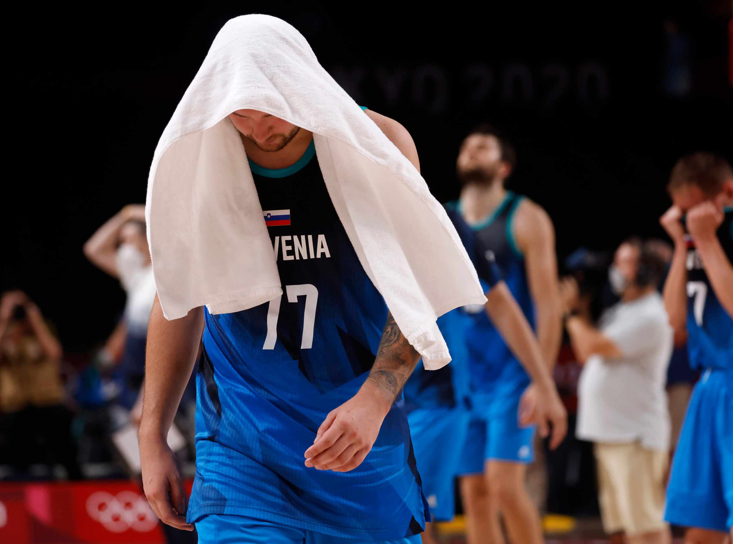 Slovenia’s Luka Doncic (77) walks off the court dejected after losing to France 90-89 after...