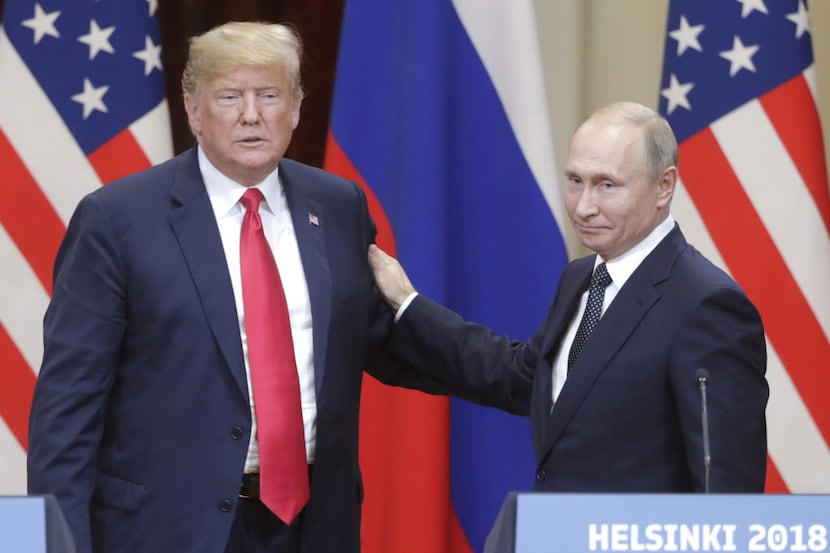 U.S. President Donald Trump and Russian President Vladimir Putin give a joint news...